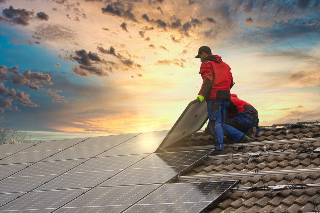 Workers laying solar panels